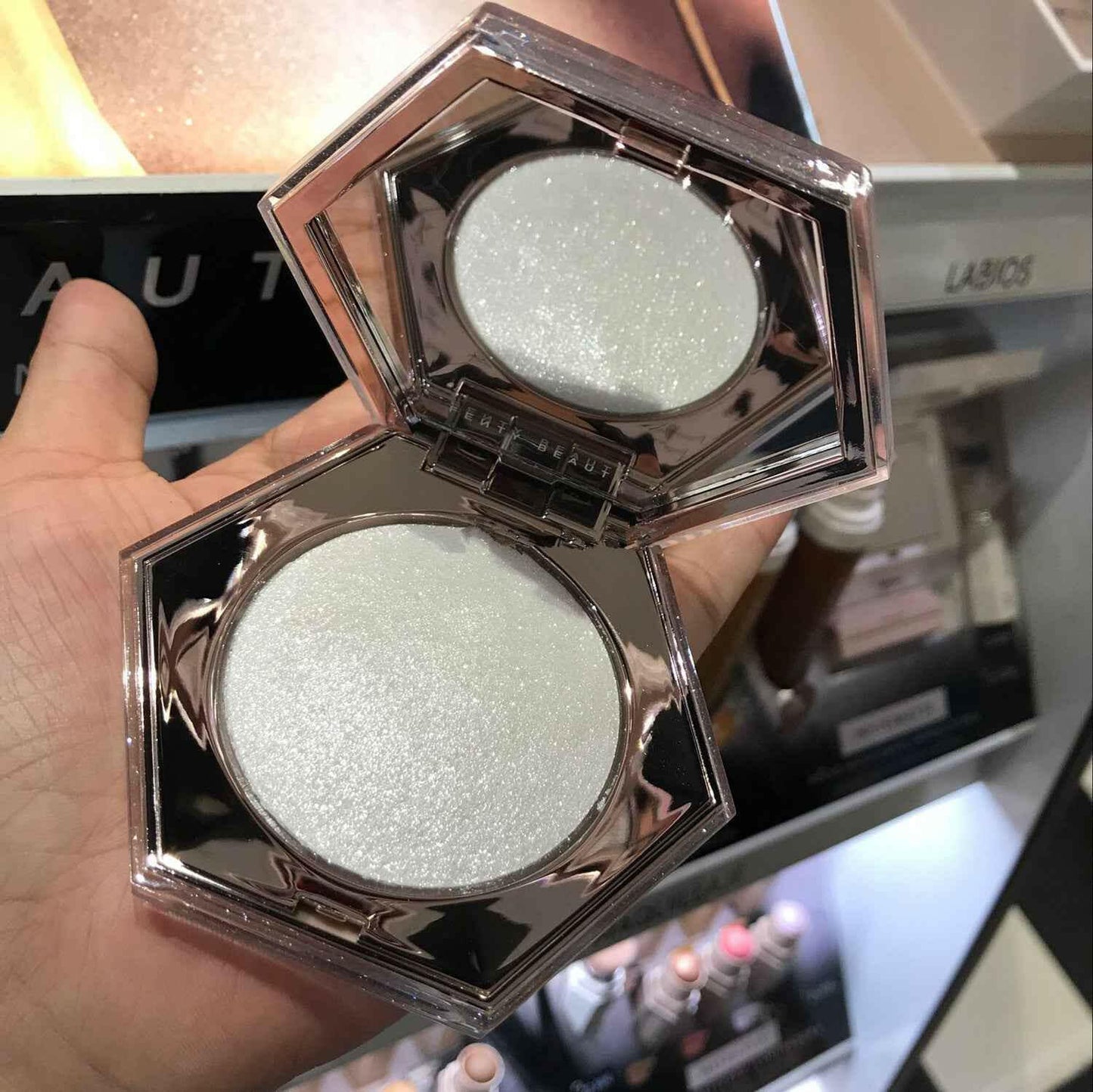 Fenty beauty diamond bomb high gloss powder.