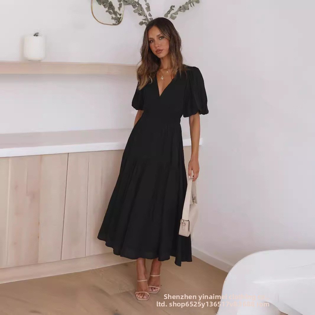 Chic Deep V Puffed Sleeve Vacation Dress – Elegant Flowy Summer Maxi for Beach & Resort Wear.