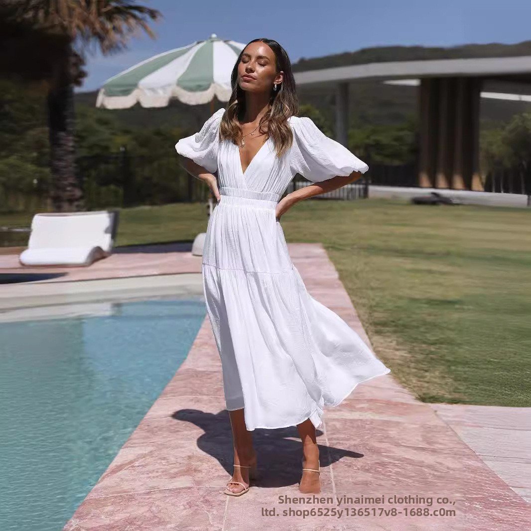 Chic Deep V Puffed Sleeve Vacation Dress – Elegant Flowy Summer Maxi for Beach & Resort Wear.
