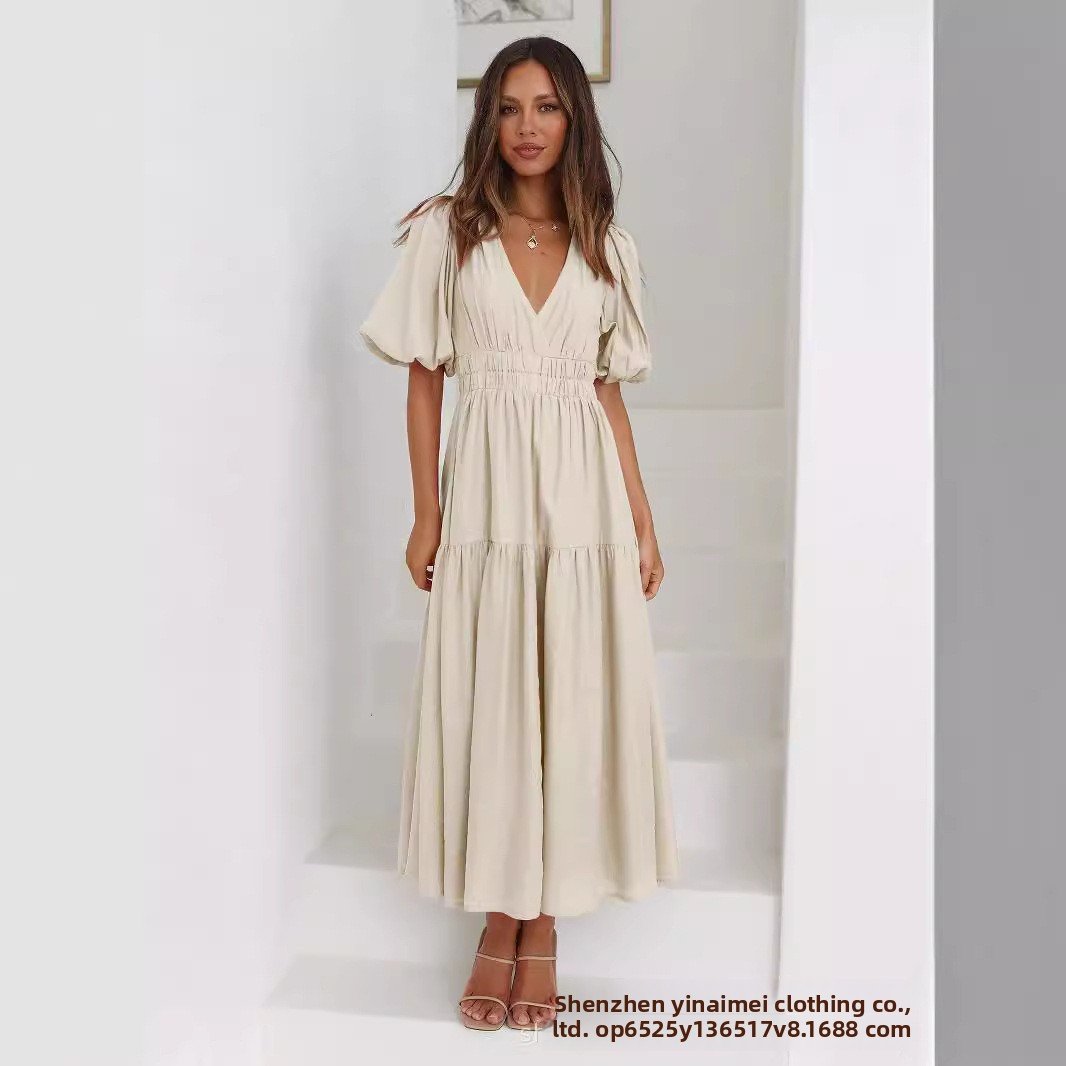 Chic Deep V Puffed Sleeve Vacation Dress – Elegant Flowy Summer Maxi for Beach & Resort Wear.