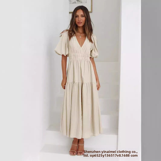 Chic Deep V Puffed Sleeve Vacation Dress – Elegant Flowy Summer Maxi for Beach & Resort Wear.